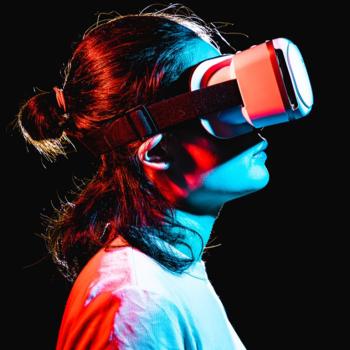 Person using vr glasses on black background
